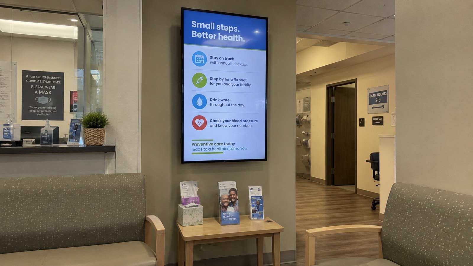 Illustrative example — SpotrOS digital signage on a medical waiting-room screen